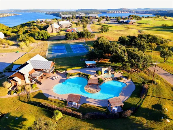an aerial view of residential houses with outdoor space