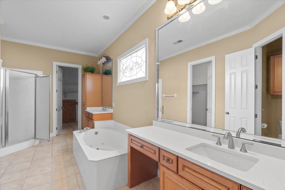 1435 Kimbrough Road Germantown, TN 38138 - Photo 11 of 34 a bathroom with a sink and a mirror