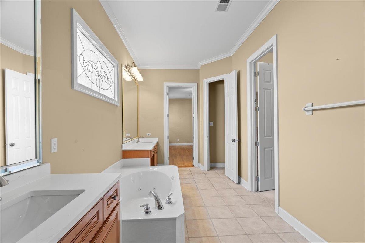 1435 Kimbrough Road Germantown, TN 38138 - Photo 13 of 34 a bedroom with a bed and a sink