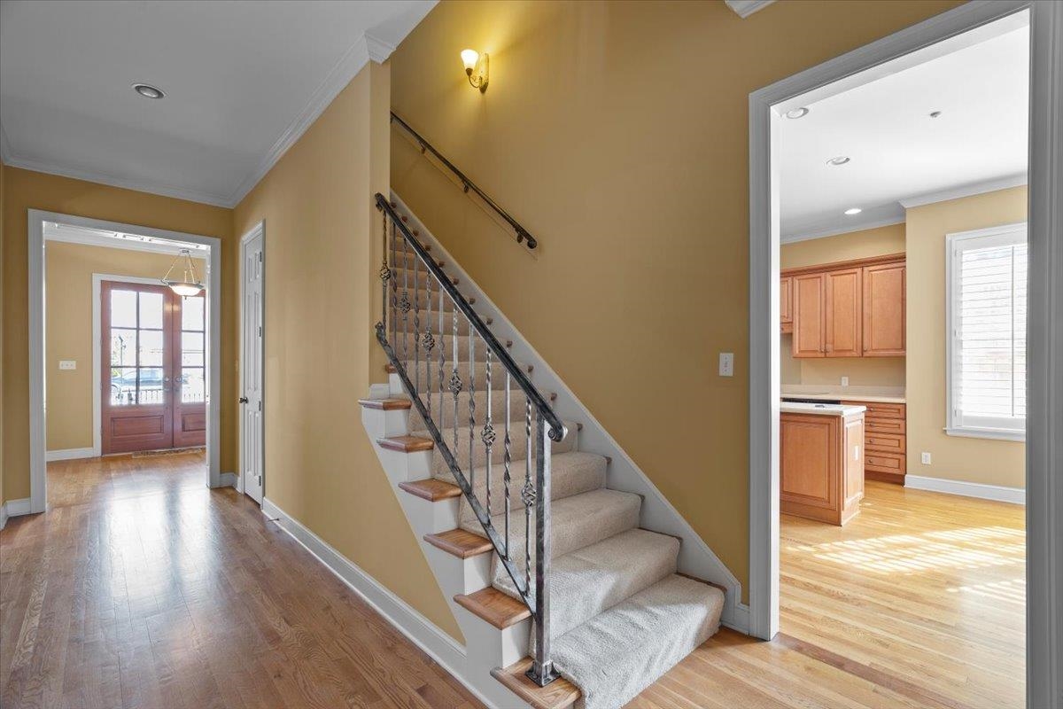 1435 Kimbrough Road Germantown, TN 38138 - Photo 14 of 34 a view of staircase with wooden floor and a large window