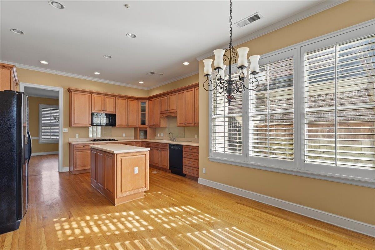 1435 Kimbrough Road Germantown, TN 38138 - Photo 16 of 34 a kitchen with stainless steel appliances kitchen island granite countertop a refrigerator and a sink