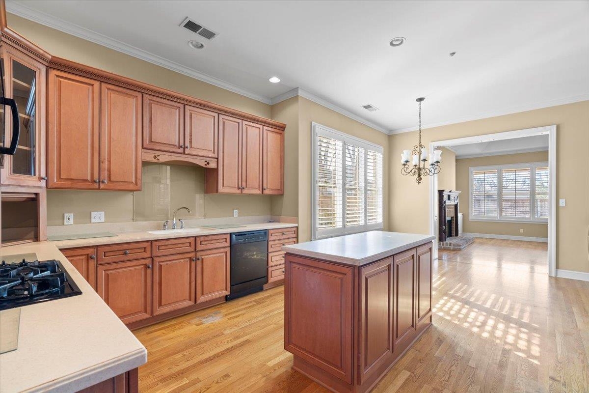 1435 Kimbrough Road Germantown, TN 38138 - Photo 18 of 34 a kitchen with stainless steel appliances granite countertop a sink stove and refrigerator