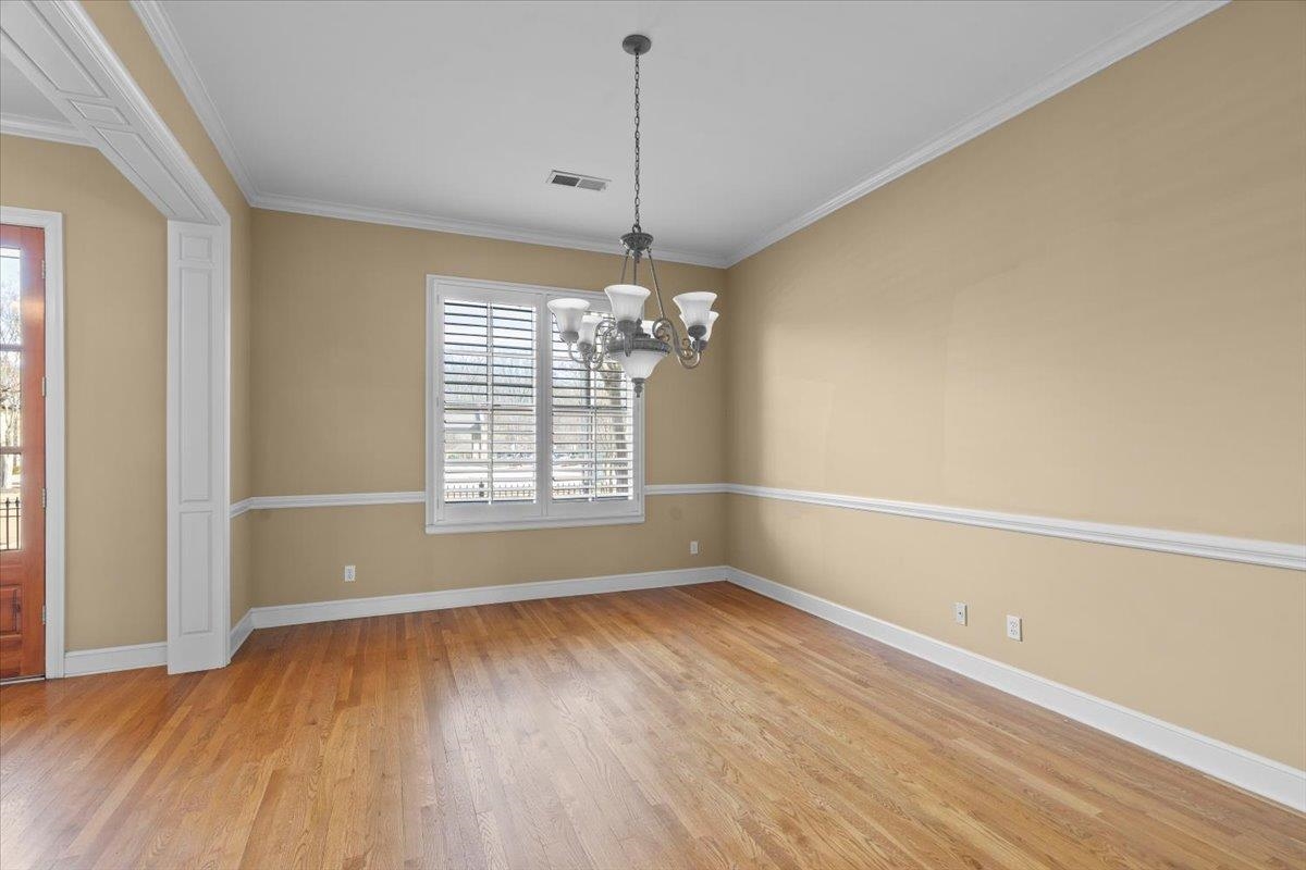 1435 Kimbrough Road Germantown, TN 38138 - Photo 19 of 34 a view of livingroom with window wooden floor and chandelier