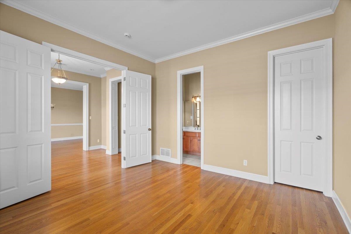 1435 Kimbrough Road Germantown, TN 38138 - Photo 22 of 34 a view of an empty room with wooden floor
