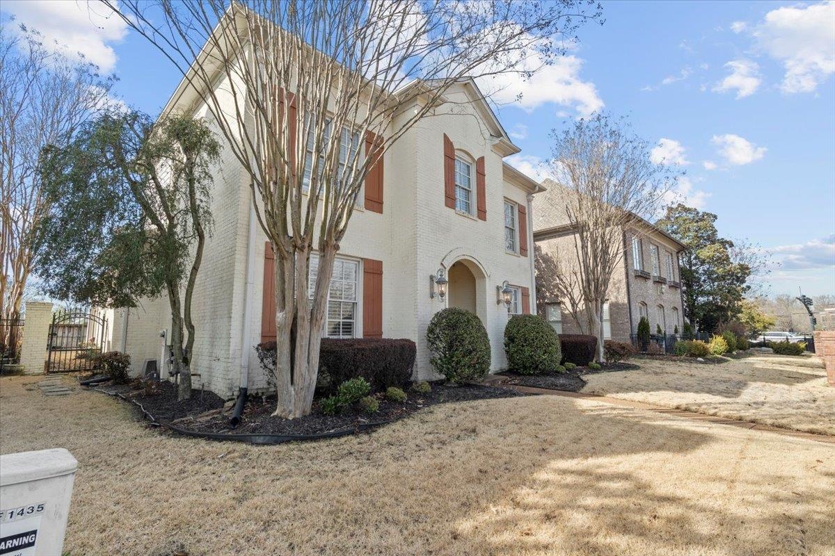 1435 Kimbrough Road Germantown, TN 38138 - Photo 3 of 34 a front view of a house with a yard
