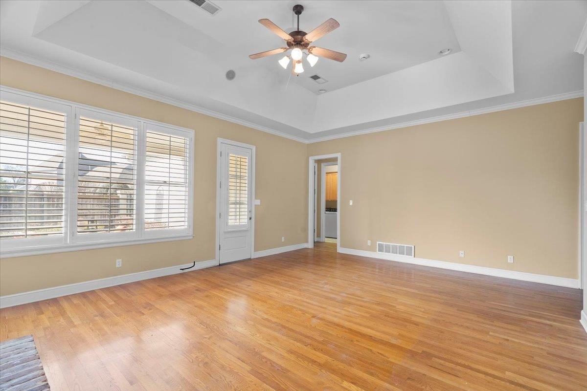 1435 Kimbrough Road Germantown, TN 38138 - Photo 6 of 34 a view of an empty room with a window and a ceiling fan