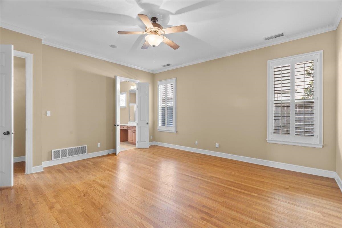 1435 Kimbrough Road Germantown, TN 38138 - Photo 9 of 34 a view of an empty room with a window and a kitchen view