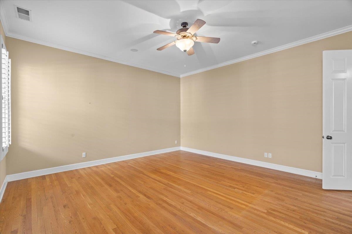 1435 Kimbrough Road Germantown, TN 38138 - Photo 10 of 34 a view of an empty room with wooden floor