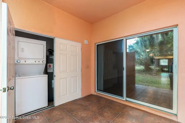 a view of backyard with balcony