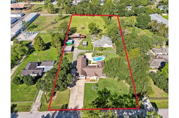 an aerial view of residential houses with outdoor space