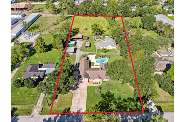 an aerial view of residential houses with outdoor space