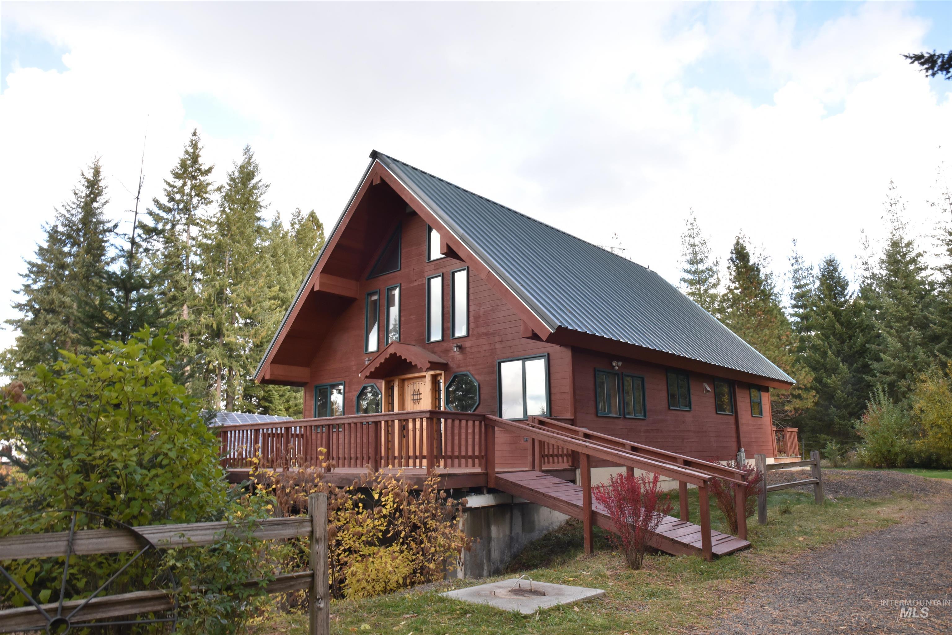 391457 Highway 95 Plummer, ID 83851 - Photo 2 of 39 View of side of property featuring a metal roof and a wooden deck