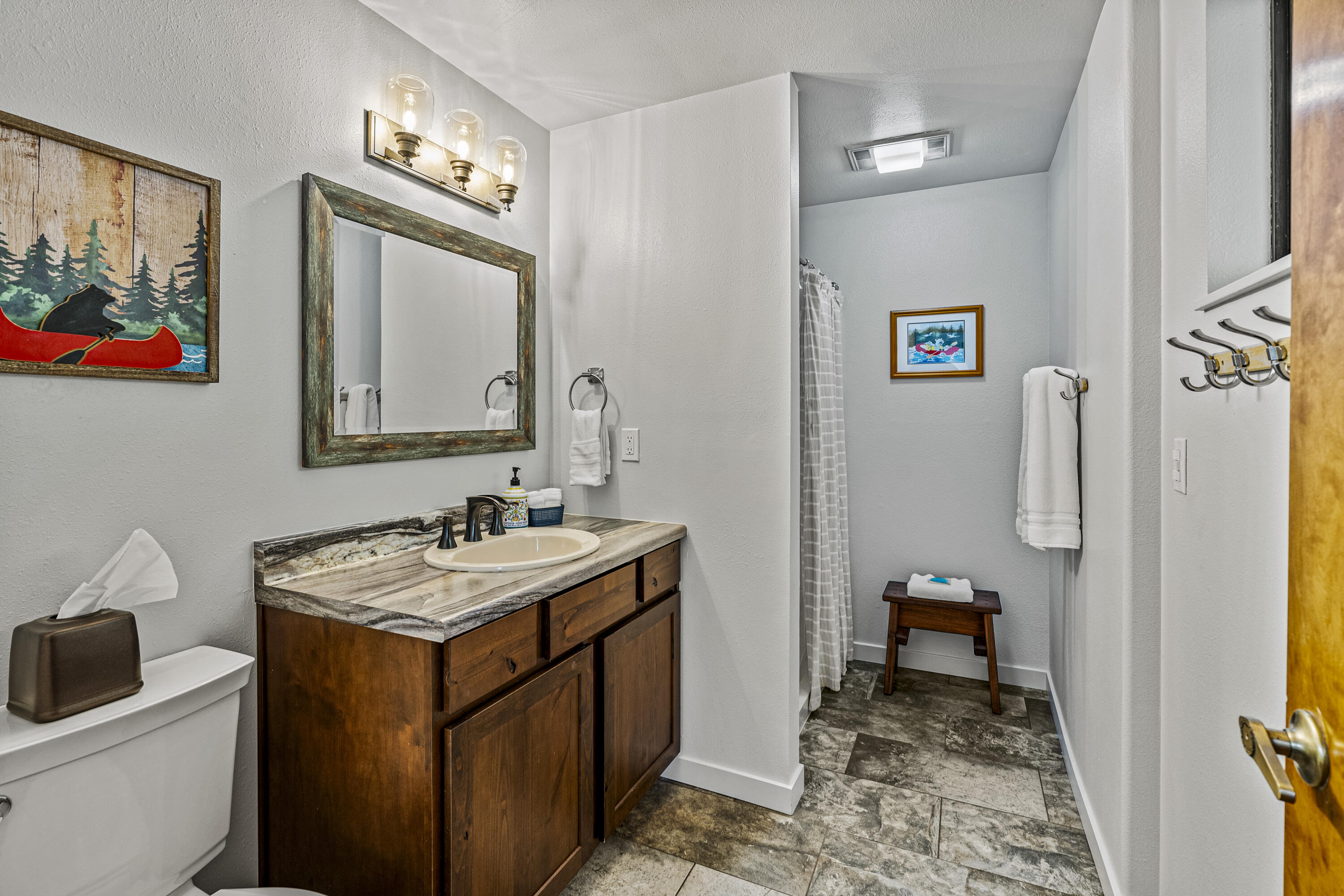 11744 Galice Road Merlin, OR 97532 - Photo 52 of 74 a bathroom with a sink mirror and a toilet