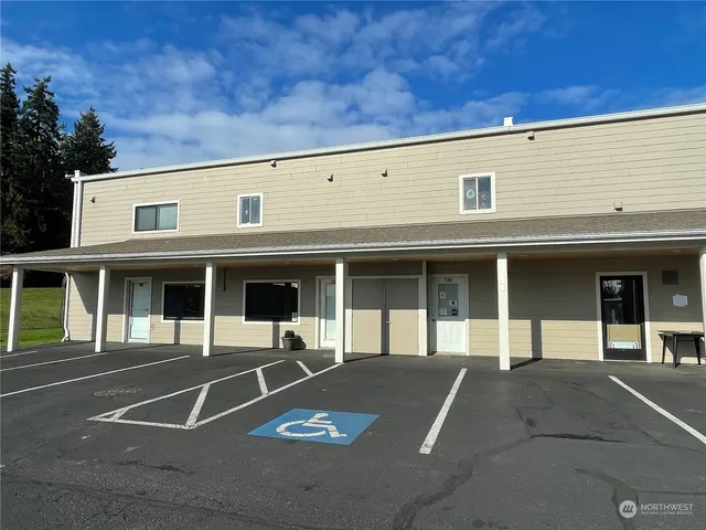 a view of a building with sitting area