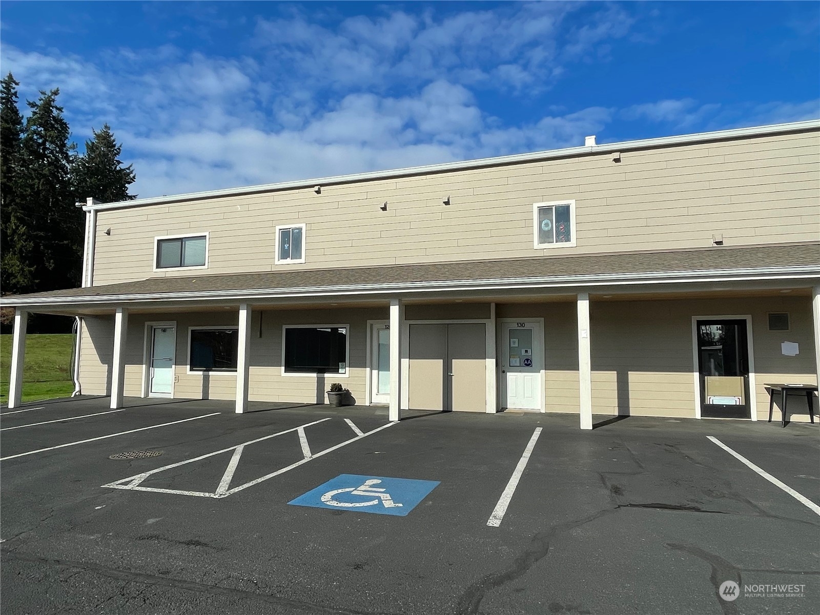 a view of a building with sitting area