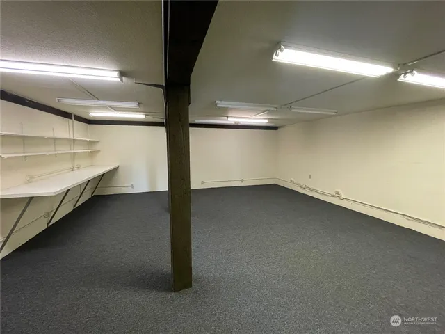 a view of an empty room with windows