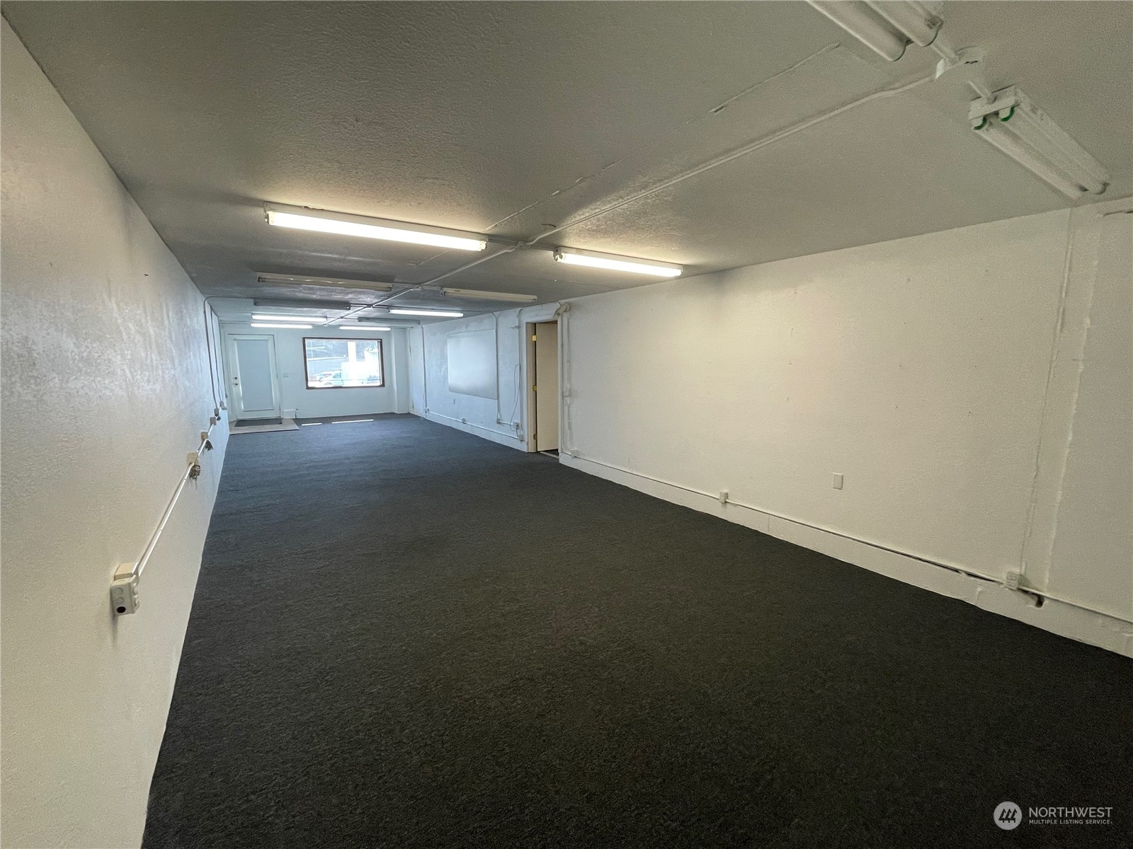 2800 Northeast Lindvog Road Kingston, WA 98346 - Photo 9 of 10 an empty room with windows