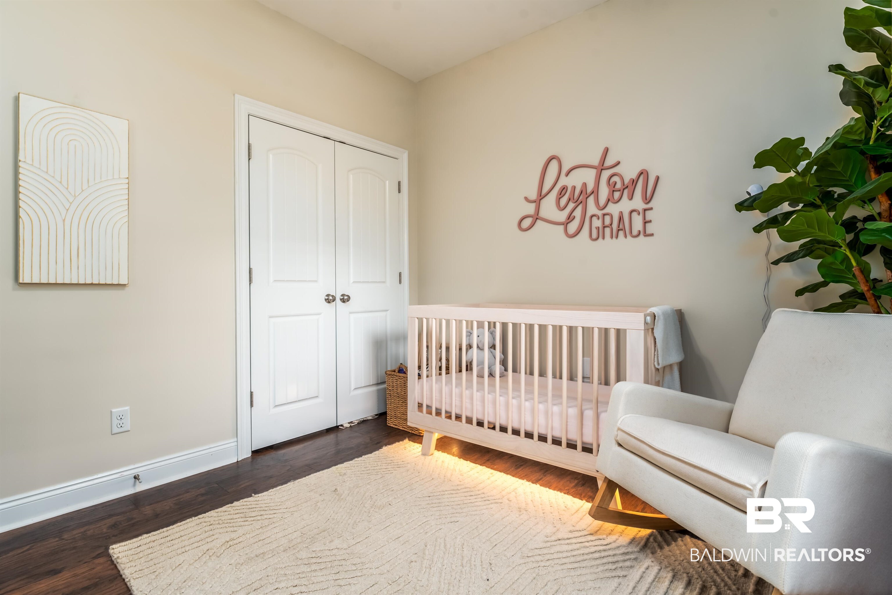 965 Henckley Avenue Mobile, AL 36609 - Photo 18 of 30 Bedroom featuring dark hardwood / wood-style floors, a nursery area, and a closet