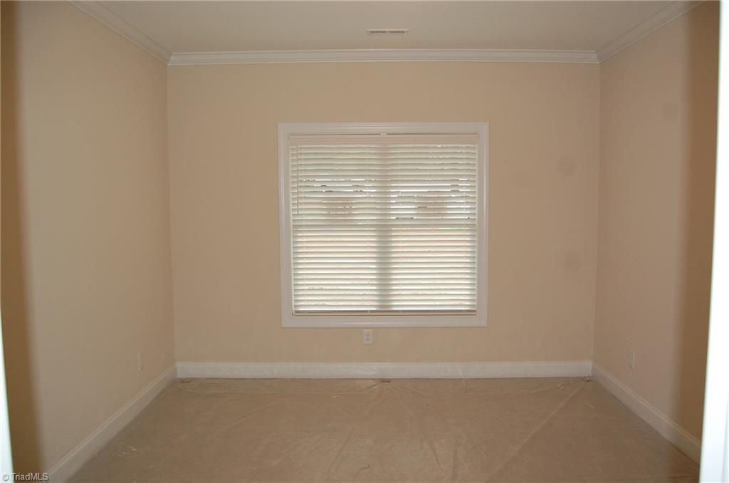 4629 Tower Road Greensboro, NC 27410 - Photo 14 of 18 Bedrooms two and three each have a private bath and walk in closet.