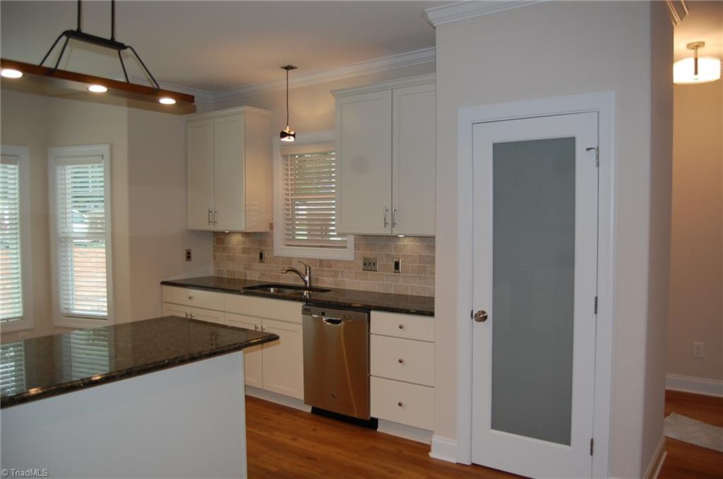 4629 Tower Road Greensboro, NC 27410 - Photo 3 of 18 Plenty of cabinets and a separate pantry