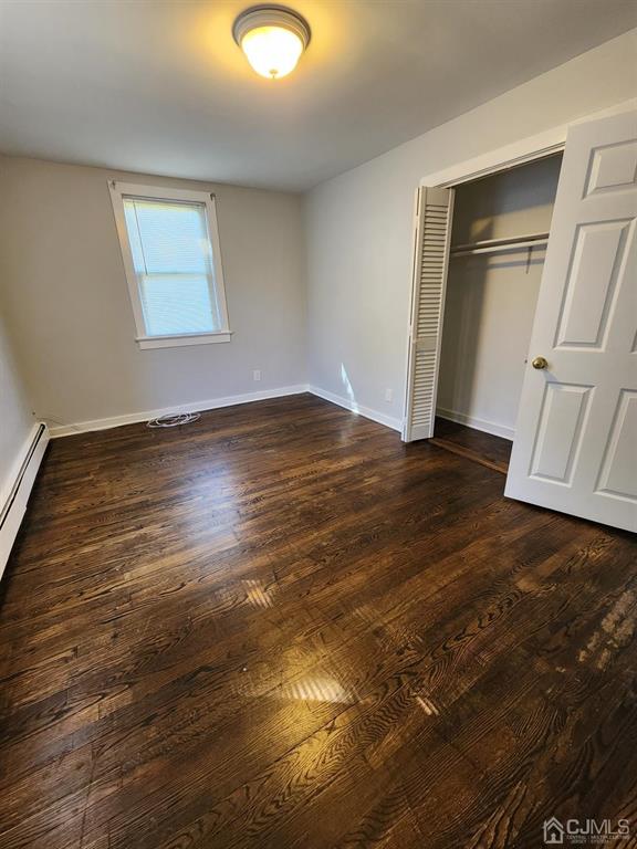 4271 Highway 27, Unit 73 Princeton, NJ 08540 - Photo 17 of 23 an empty room with wooden floor and closet