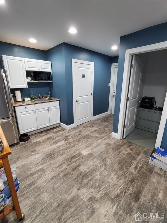 4271 Highway 27, Unit 73 Princeton, NJ 08540 - Photo 4 of 23 a view of a kitchen with fridge and a sink