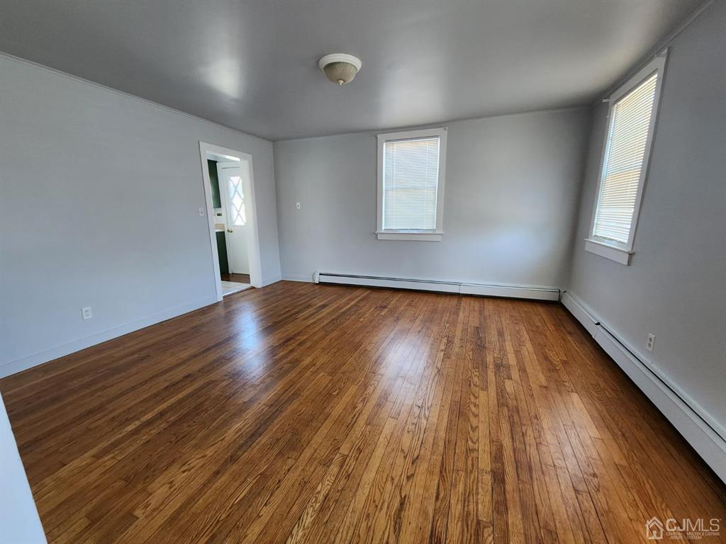 4271 Highway 27, Unit 73 Princeton, NJ 08540 - Photo 10 of 23 an empty room with wooden floor and windows