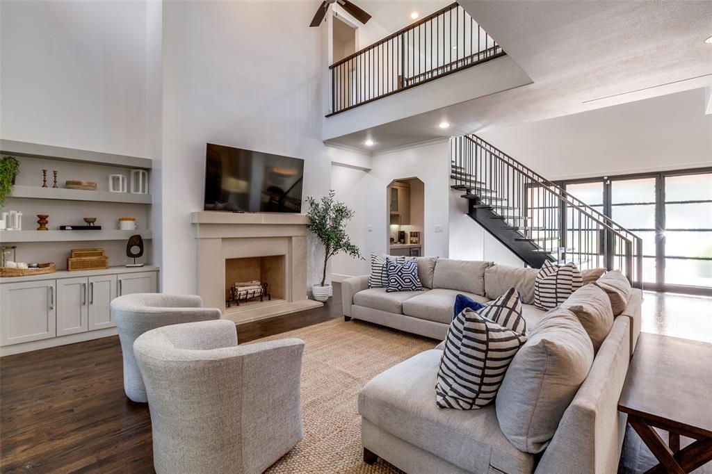 a living room with furniture fireplace and flat screen tv