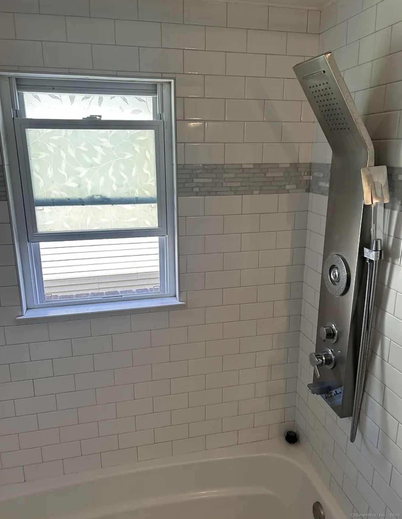 80 Taft Avenue, Unit 9 Bridgeport, CT 06606 - Photo 3 of 4 a bathroom with a bathtub