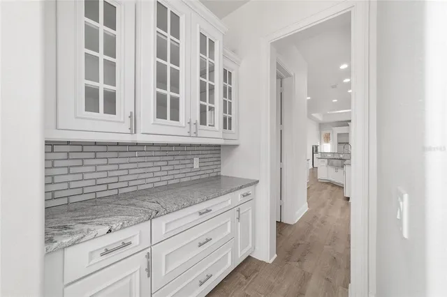 a bedroom with a large bed and a tv