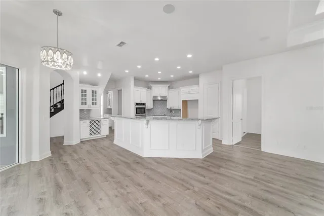 a bedroom with a bed and a potted plant