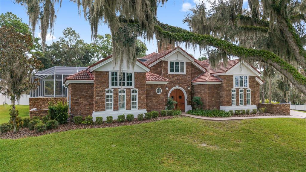 1718 Southwest 27th Street Ocala, FL 34471 - Photo 2 of 91 front view of a house with a yard