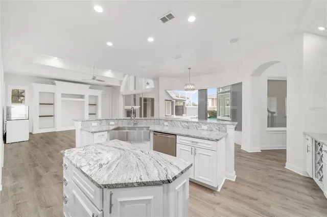 a bathroom with a sink a vanity and a mirror