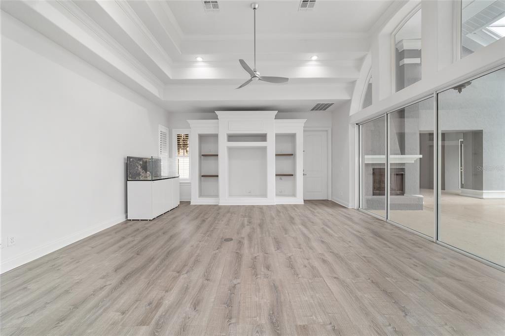 1718 Southwest 27th Street Ocala, FL 34471 - Photo 27 of 91 a view of empty room with wooden floor and fireplace