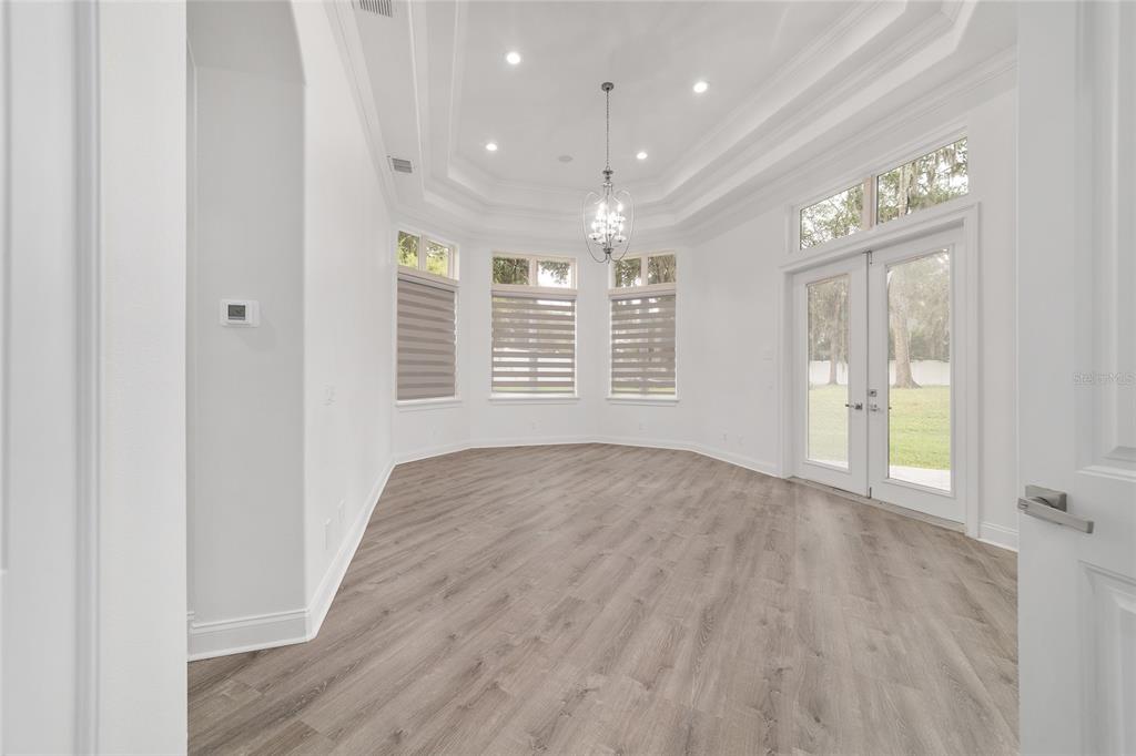 1718 Southwest 27th Street Ocala, FL 34471 - Photo 29 of 91 an empty room with wooden floor and windows