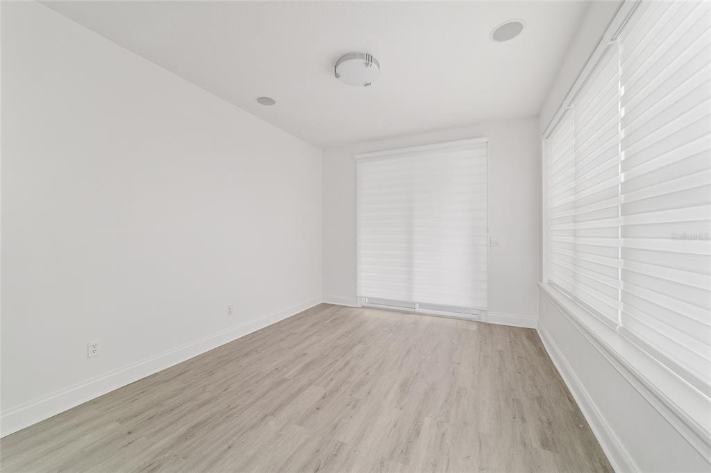 1718 Southwest 27th Street Ocala, FL 34471 - Photo 43 of 91 a view of an empty room with wooden floor and a window
