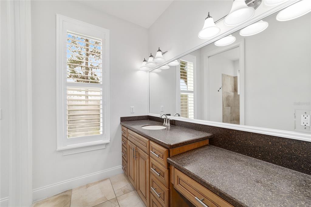 1718 Southwest 27th Street Ocala, FL 34471 - Photo 45 of 91 a bathroom with a sink a vanity and a mirror
