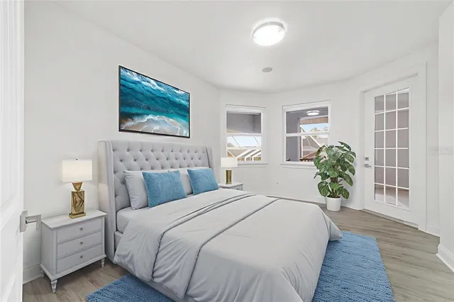 a front view of a house with a yard and palm trees