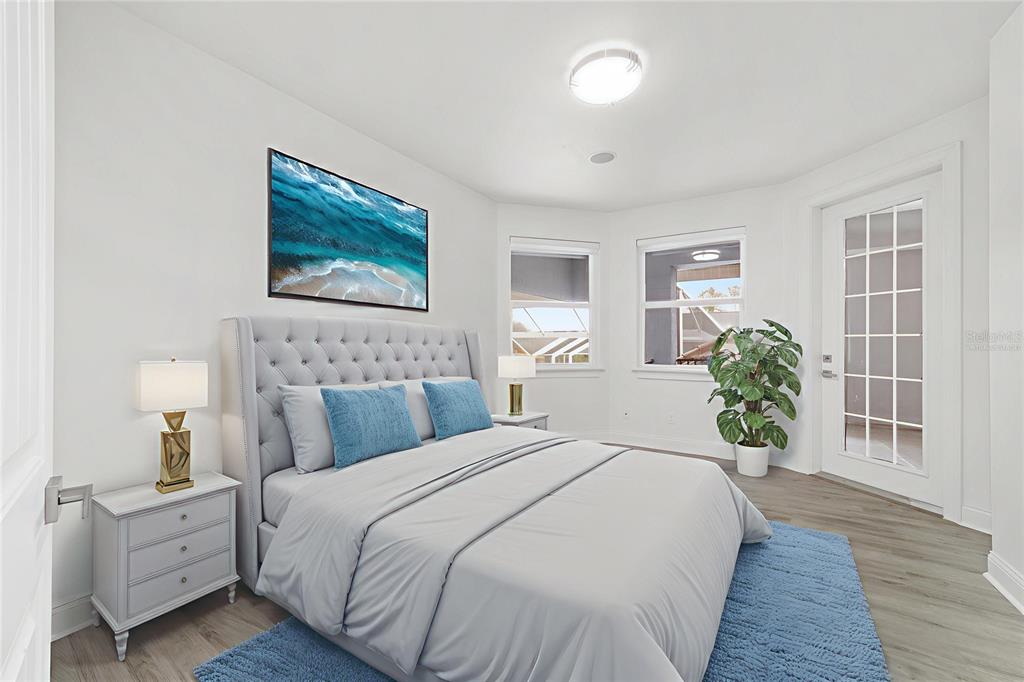 1718 Southwest 27th Street Ocala, FL 34471 - Photo 47 of 91 a spacious bedroom with a bed and a couch