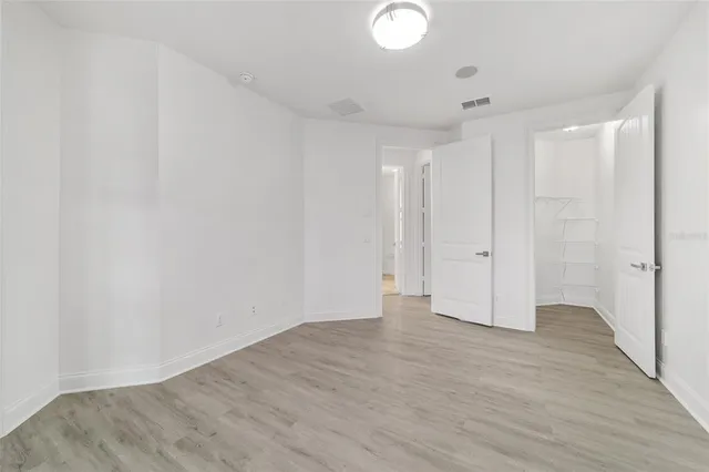 a picture of a room with a white table and chairs