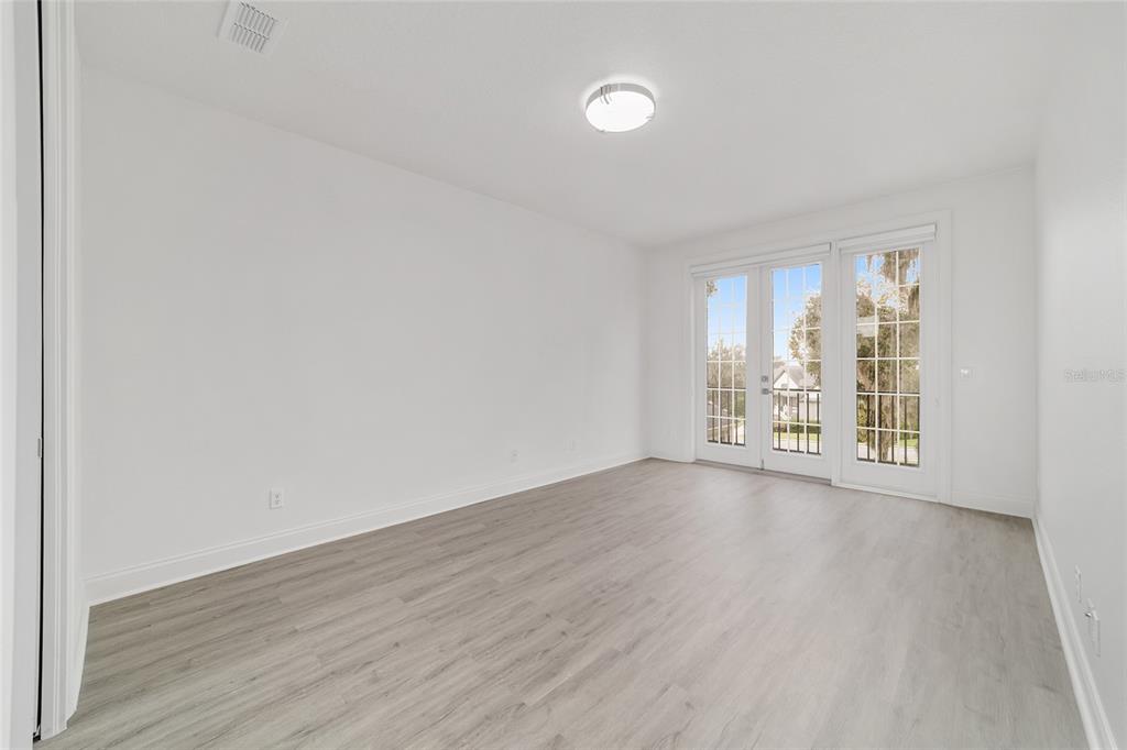 1718 Southwest 27th Street Ocala, FL 34471 - Photo 55 of 91 a view of an empty room with wooden floor and a window
