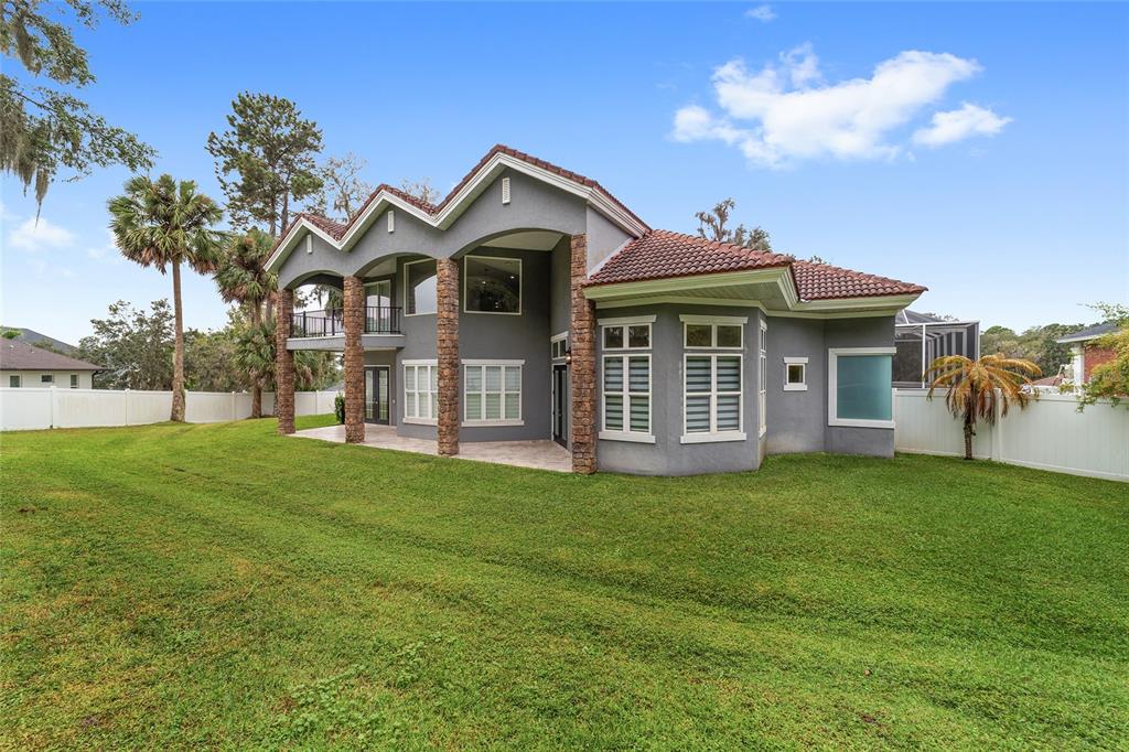1718 Southwest 27th Street Ocala, FL 34471 - Photo 78 of 91 a front view of a house with a garden