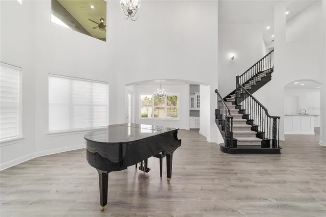 a view of large kitchen with granite countertop lots of counter space and stainless steel appliances