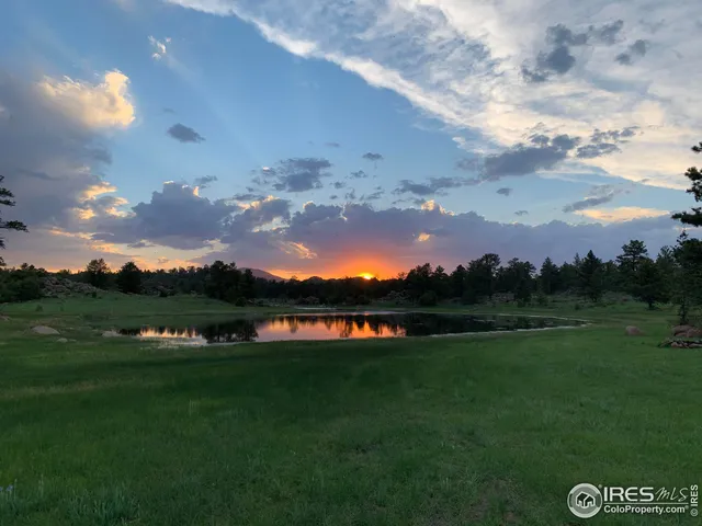 a view of a lake with a big yard