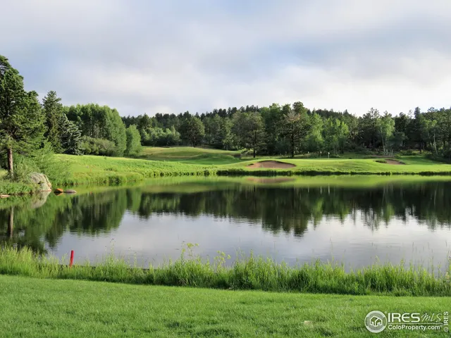 a view of a lake with a big yard