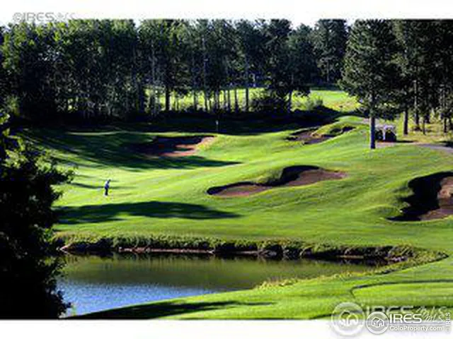 a view of a golf course with a lake
