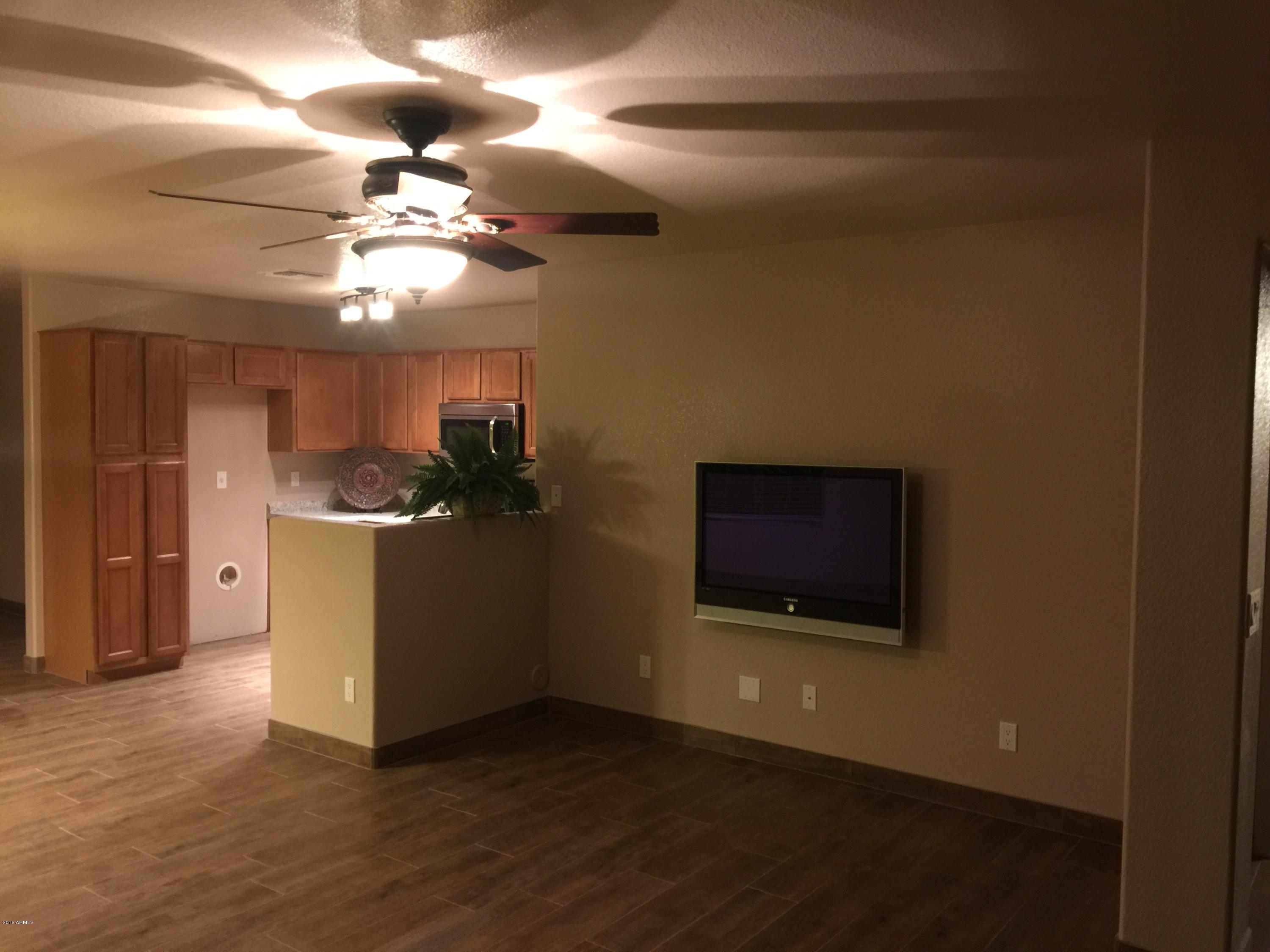 17420 West Calavar Road Surprise, AZ 85388 - Photo 8 of 12 Family Room 2