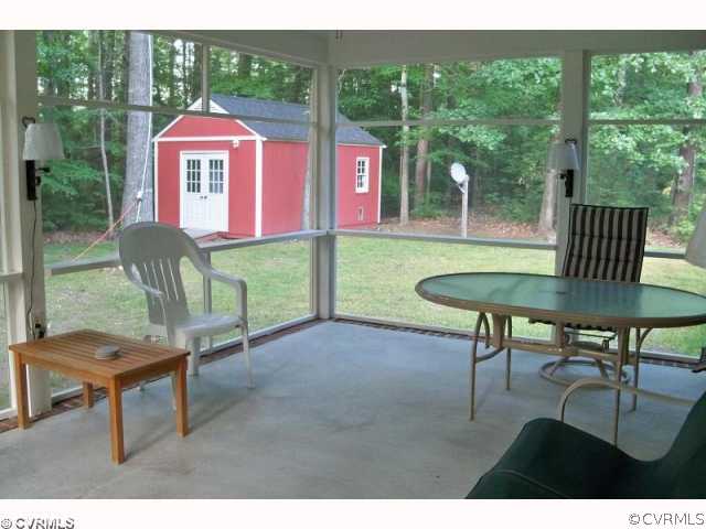 14218 River Road Chesterfield, VA 23838 - Photo 3 of 7 a patio with table and chairs