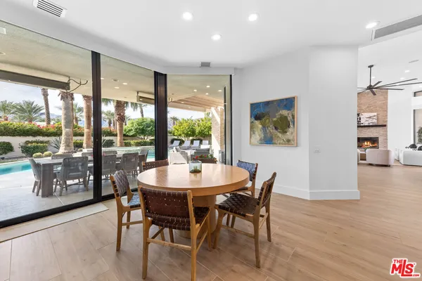a view of a dining room with furniture window and wooden floor