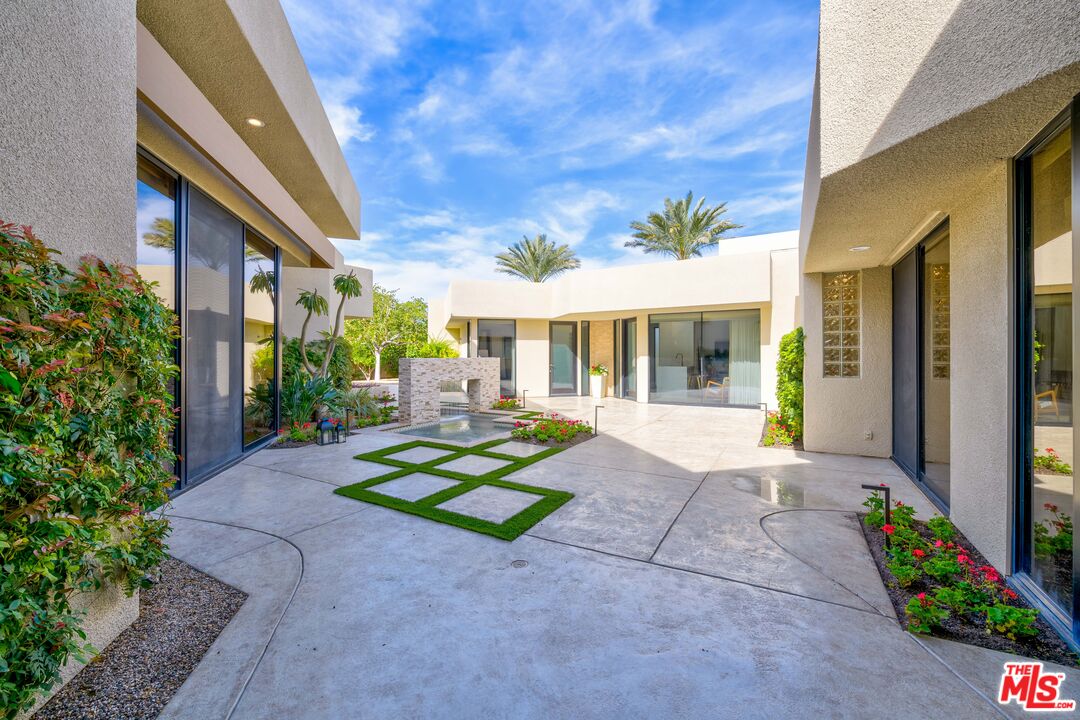 79400 Stonegate La Quinta, CA 92253 - Photo 21 of 46 a view of house with backyard and outdoor seating